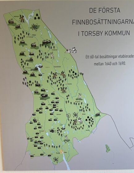 A map with pictures of farmhouses among the lakes and trees